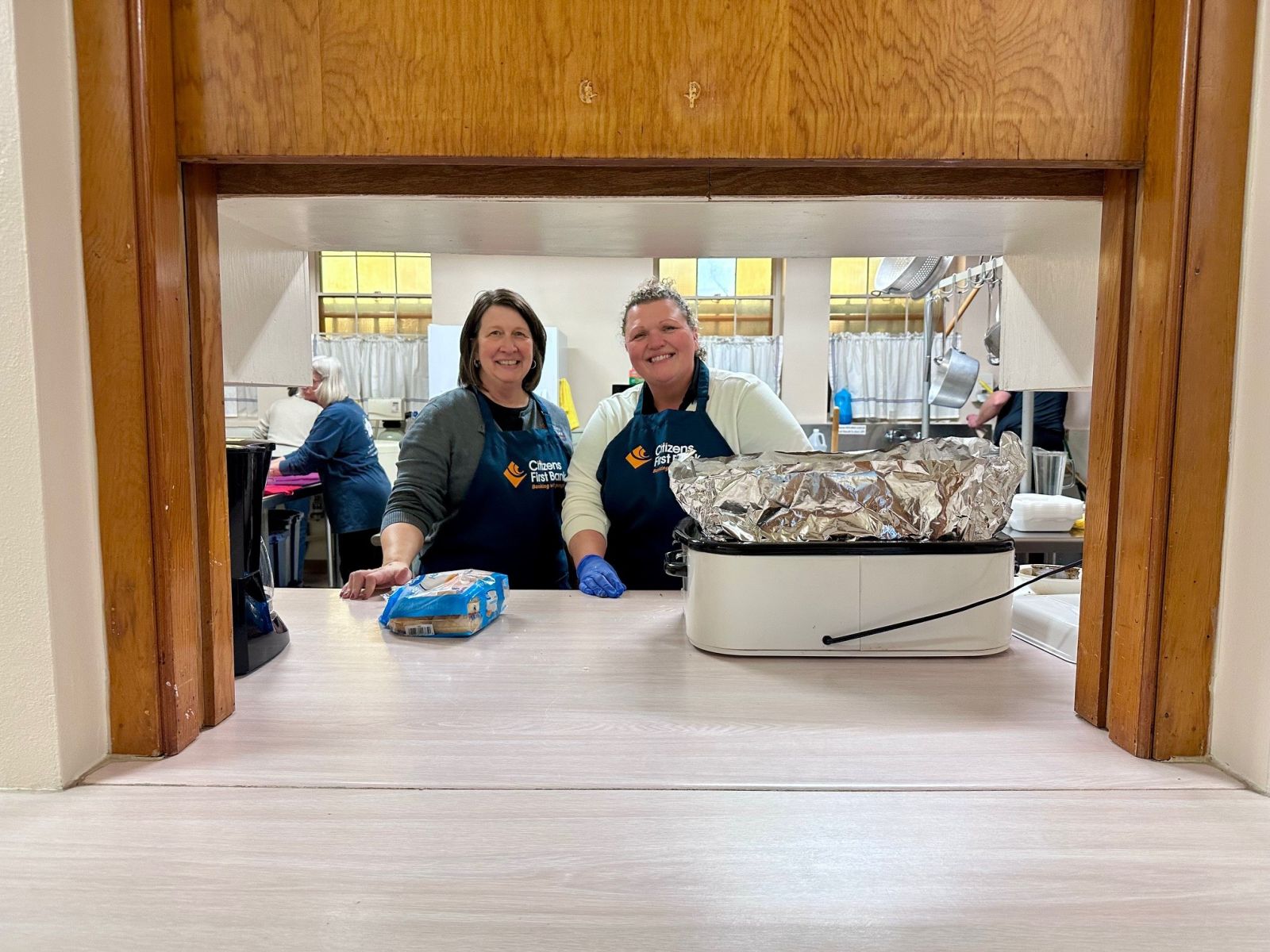 Citizens First Bank employees volunteering at a community dinner