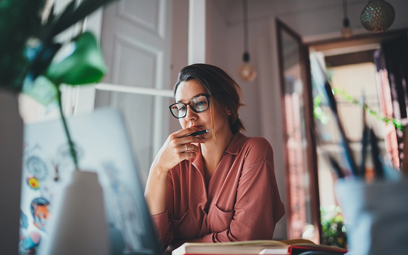 woman looking at a laptop