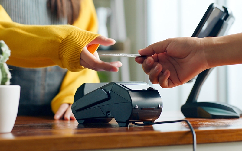 person paying with credit card