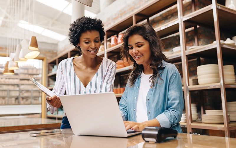two women on a laptop