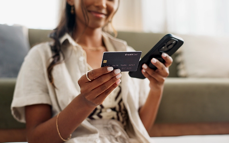 girl holding credit card
