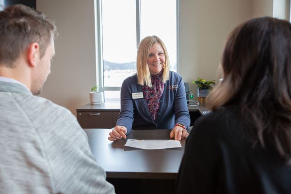 Holmen Branch Manager assisting customers